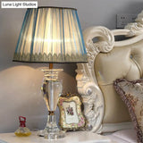 Traditional Blue Fabric Nightstand Lamp With Crystal Base - 1 Light Barrel Design