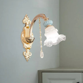 Traditional Blue Frosted Glass Wall Sconce With Ceramic Accent And Ruffle Trim 1 /