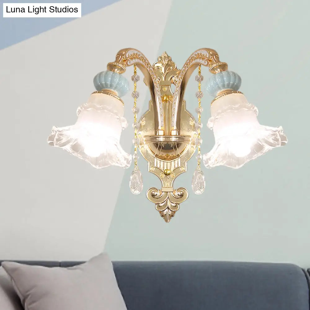 Traditional Blue Frosted Glass Wall Sconce With Ceramic Accent And Ruffle Trim