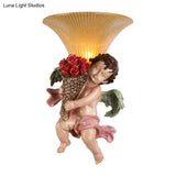 Traditional Boy Holding Rose Resin Wall Sconce Light With Fluted Glass Shade - Yellow