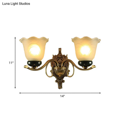 Traditional Brass Floral Wall Lamp With Frosted Glass And Carved Backplate