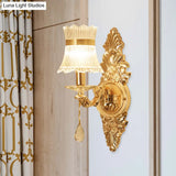 Traditional Clear Ribbed Glass Wall Sconce Light With Gold Carved Arm - Flower/Sector Design