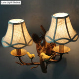 Traditional Flared Brown Fabric Wall Light With Decorative Bird And Pinecone - Perfect For