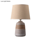Traditional Flaxen/Grey Nightstand Lamp With Ceramic Base - 1-Light Fabric Drum Desk Light