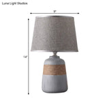 Traditional Flaxen/Grey Nightstand Lamp With Ceramic Base - 1-Light Fabric Drum Desk Light