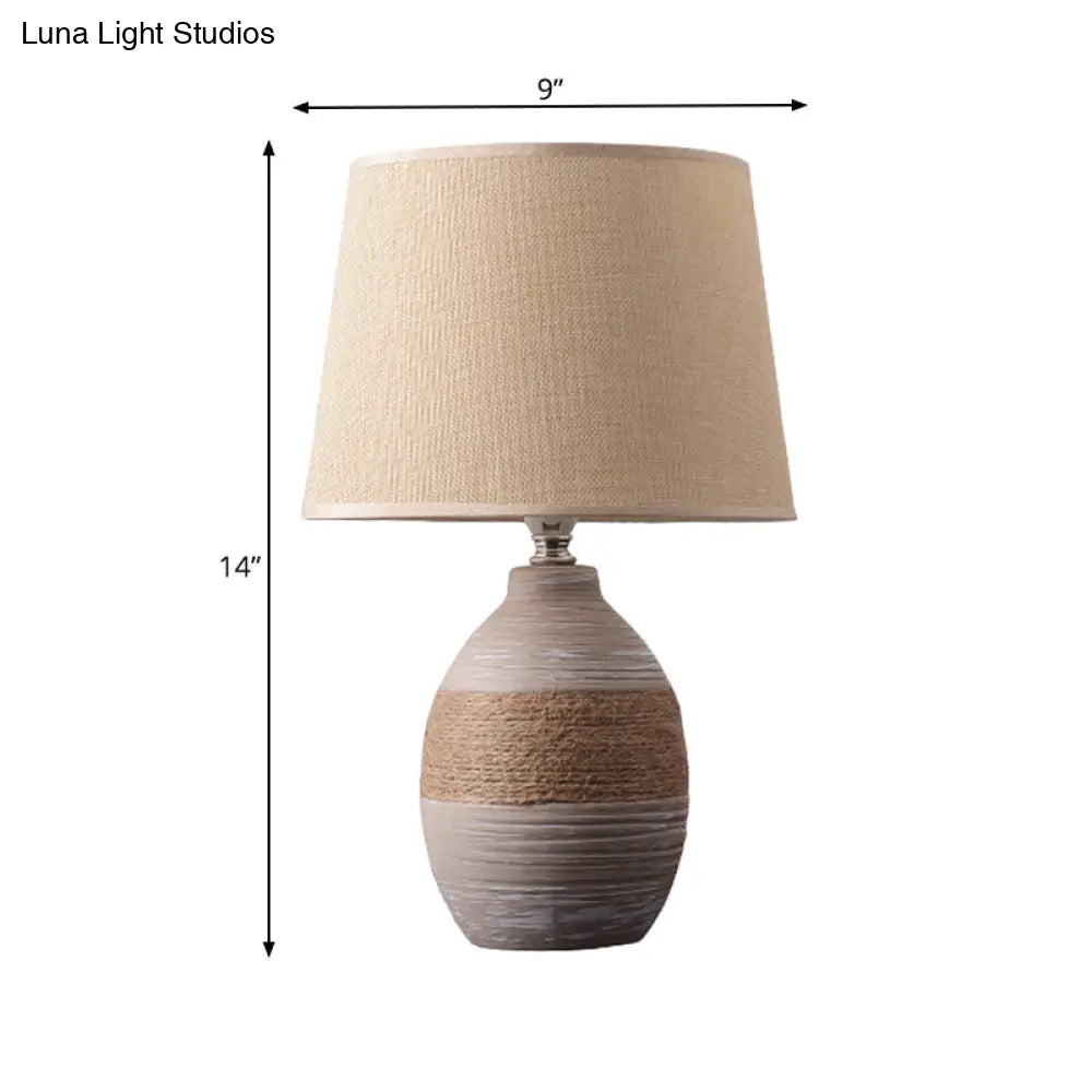Traditional Flaxen/Grey Nightstand Lamp With Ceramic Base - 1-Light Fabric Drum Desk Light