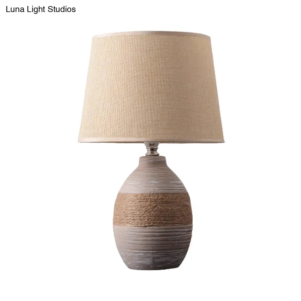 Traditional Flaxen/Grey Nightstand Lamp With Ceramic Base - 1-Light Fabric Drum Desk Light
