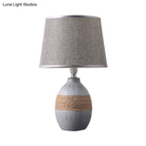 Traditional Flaxen/Grey Nightstand Lamp With Ceramic Base - 1-Light Fabric Drum Desk Light