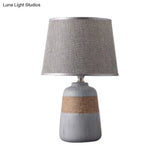 Traditional Flaxen/Grey Nightstand Lamp With Ceramic Base - 1-Light Fabric Drum Desk Light