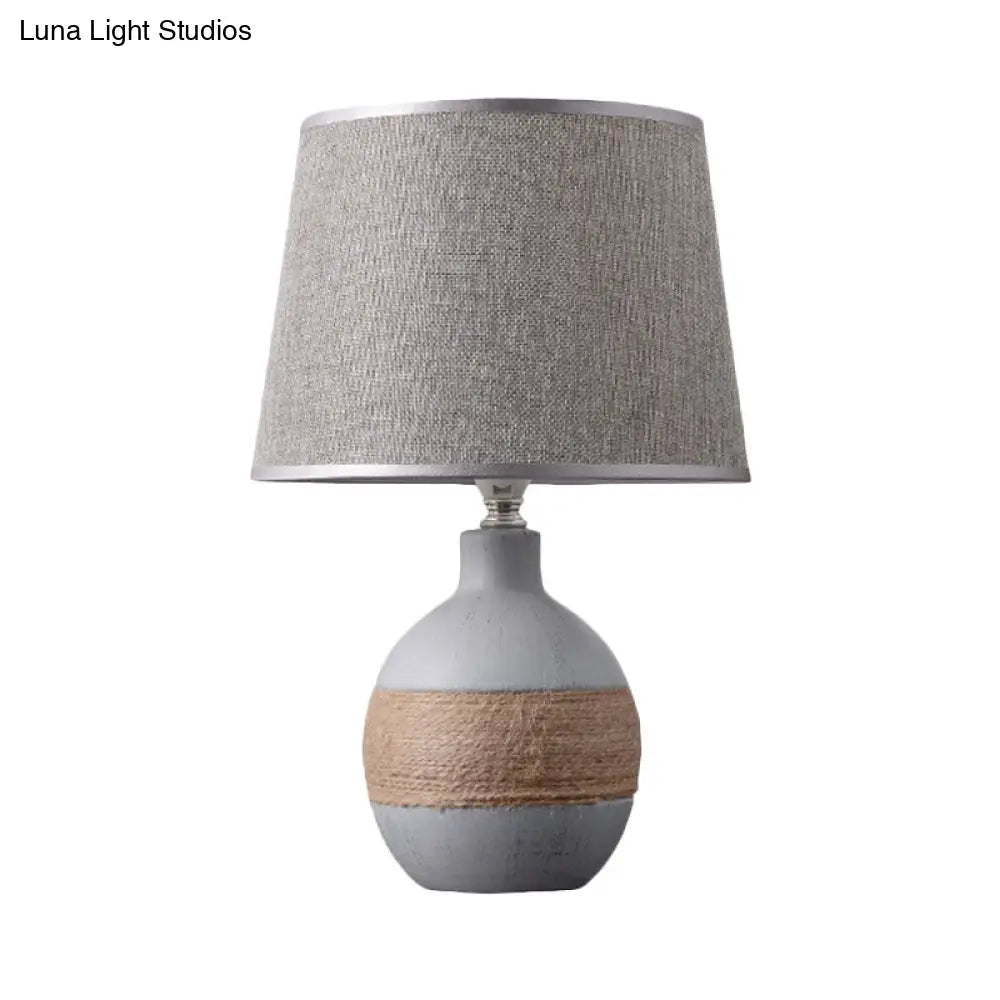 Traditional Flaxen/Grey Nightstand Lamp With Ceramic Base - 1-Light Fabric Drum Desk Light
