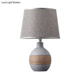 Traditional Flaxen/Grey Nightstand Lamp With Ceramic Base - 1-Light Fabric Drum Desk Light