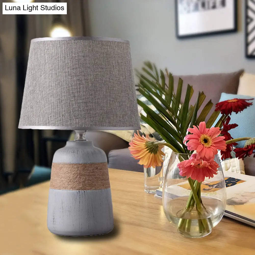 Traditional Flaxen/Grey Nightstand Lamp With Ceramic Base - 1-Light Fabric Drum Desk Light