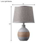 Traditional Flaxen/Grey Nightstand Lamp With Ceramic Base - 1-Light Fabric Drum Desk Light