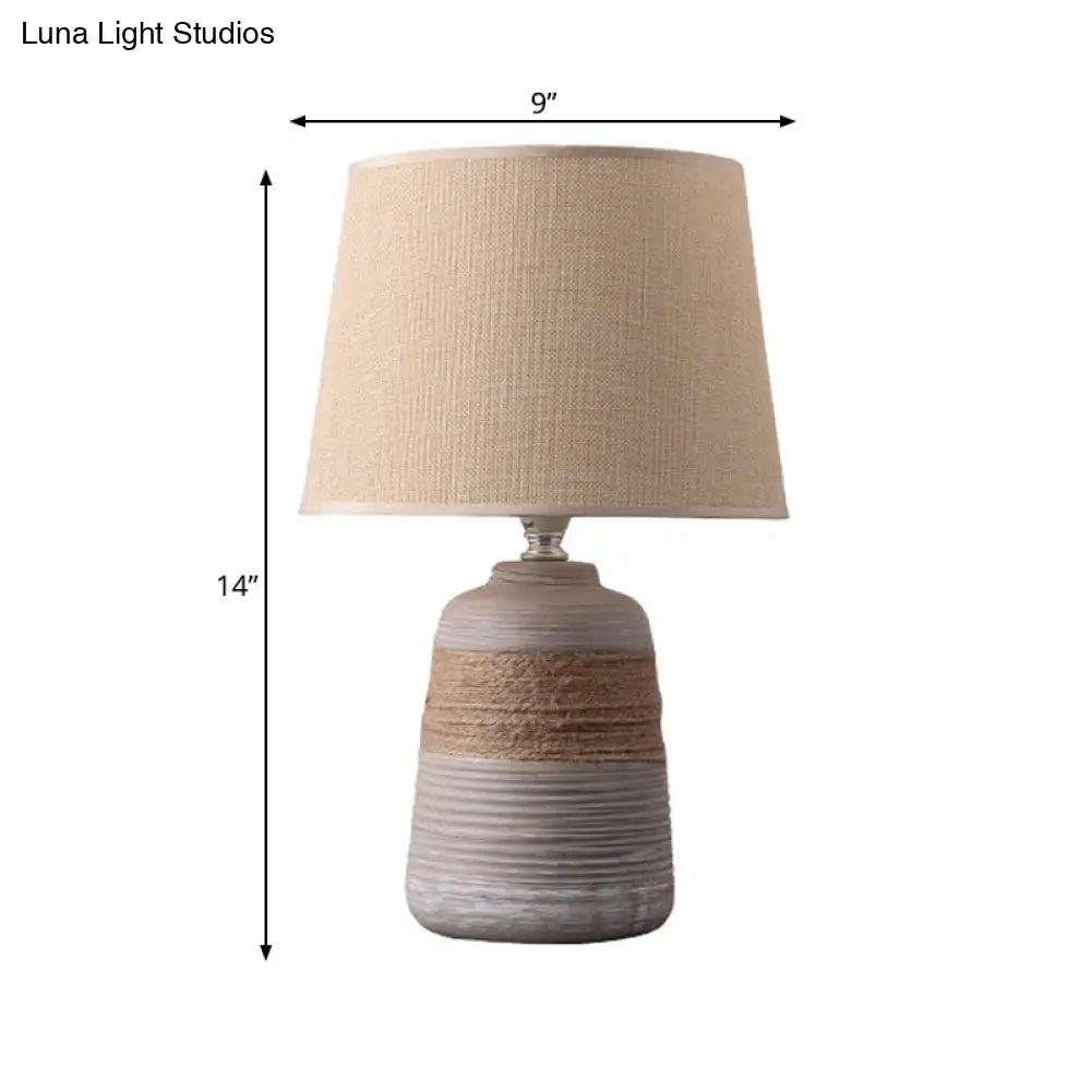 Traditional Flaxen/Grey Nightstand Lamp With Ceramic Base - 1-Light Fabric Drum Desk Light