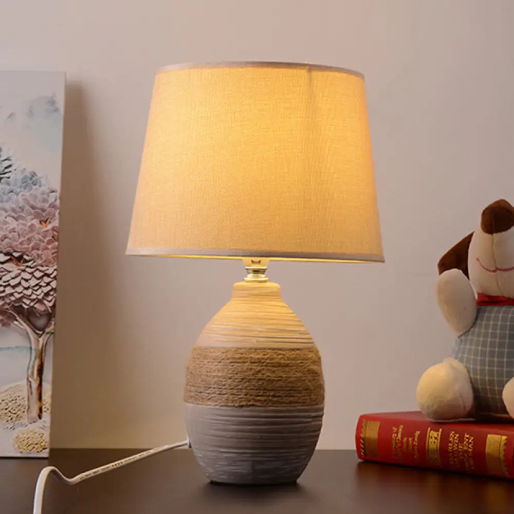 Traditional Flaxen/Grey Nightstand Lamp With Ceramic Base - 1-Light Fabric Drum Desk Light Flaxen /