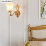 Traditional Half-Bulb Brass Wall Sconce With Bell Shade & Frosted Glass