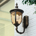 Traditional Wall Sconce: 1-Light Black Lamp With Amber Water Glass Urn Shade