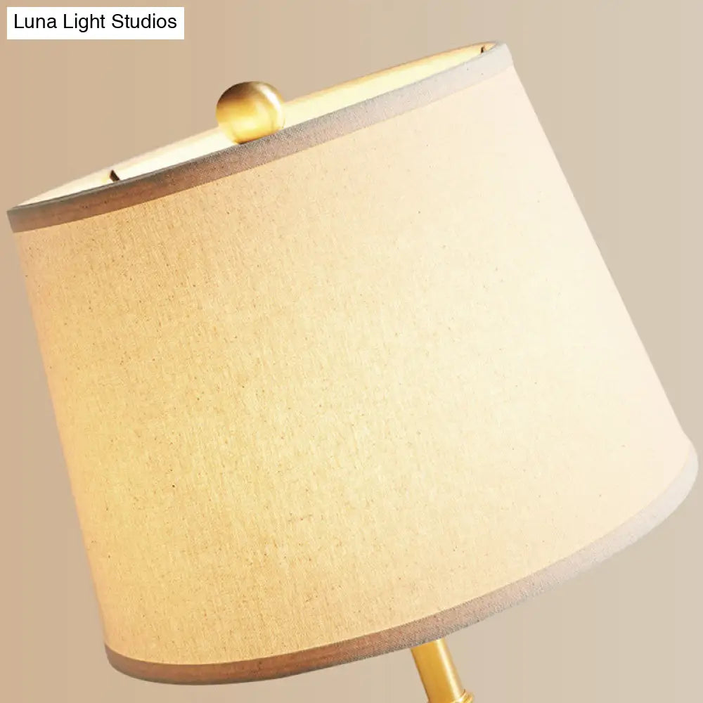 Vintage Brass Bedside Table Lamp With Single Bulb Tapered Design And Fabric Shade