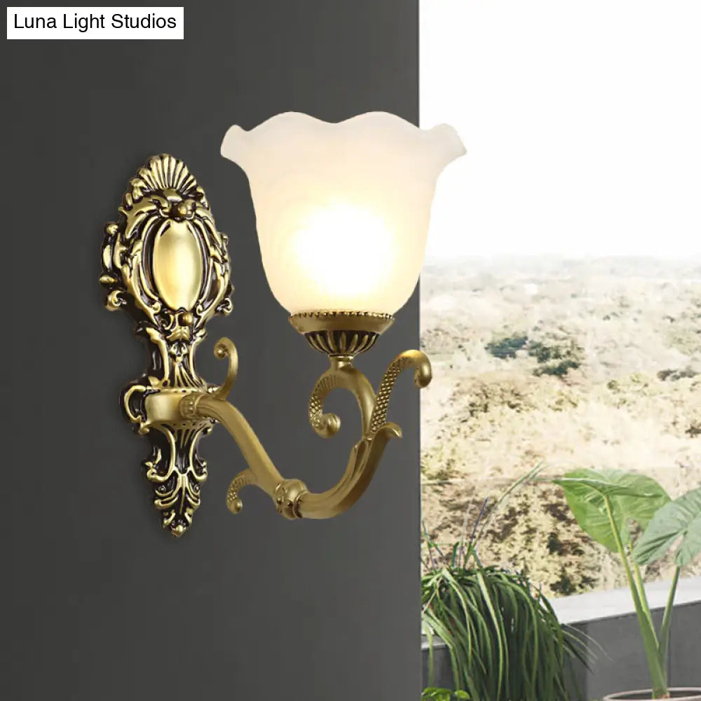 Vintage Brass/Beige Frosted Ribbed Glass Wall Sconce Lamp With Curvy Arm - 1 Light Bloom