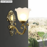 Vintage Brass/Beige Frosted Ribbed Glass Wall Sconce Lamp With Curvy Arm - 1 Light Bloom