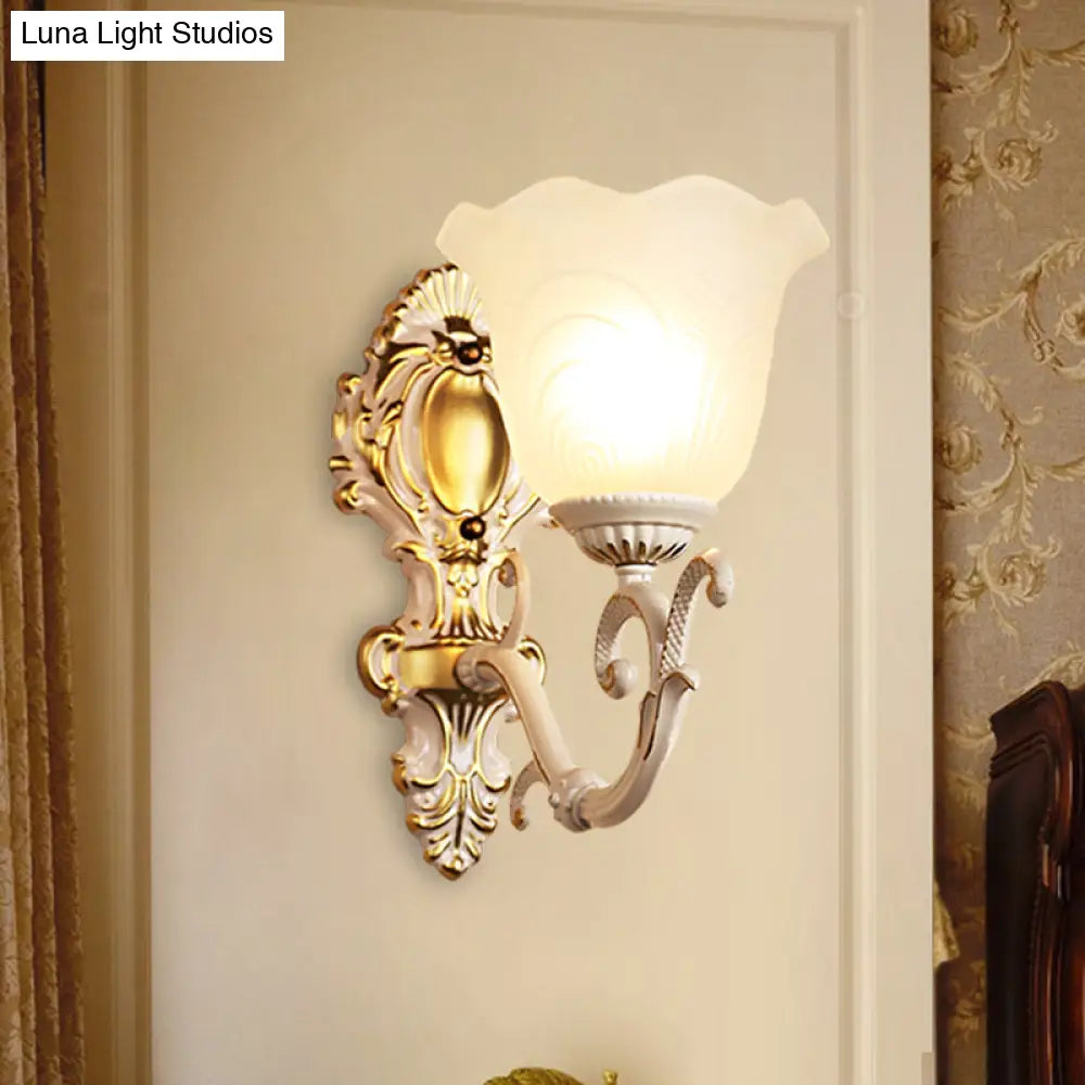 Vintage Brass/Beige Frosted Ribbed Glass Wall Sconce Lamp With Curvy Arm - 1 Light Bloom