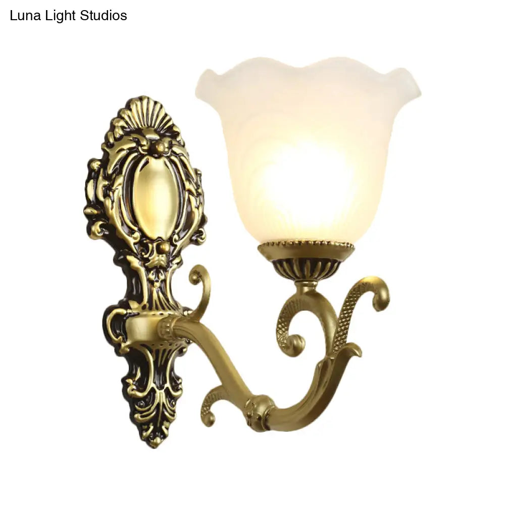 Vintage Brass/Beige Frosted Ribbed Glass Wall Sconce Lamp With Curvy Arm - 1 Light Bloom