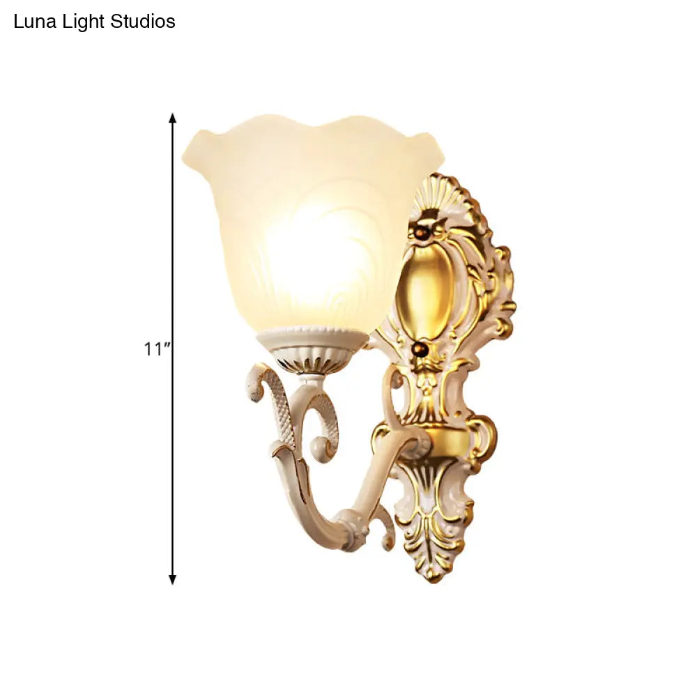 Vintage Brass/Beige Frosted Ribbed Glass Wall Sconce Lamp With Curvy Arm - 1 Light Bloom