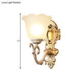 Vintage Brass/Beige Frosted Ribbed Glass Wall Sconce Lamp With Curvy Arm - 1 Light Bloom