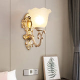 Vintage Brass/Beige Frosted Ribbed Glass Wall Sconce Lamp With Curvy Arm - 1 Light Bloom Beige