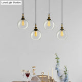 Vintage Industrial Brass Orb Pendant Light With Clear Glass Shade - 3/4-Light Multi Hanging Fixture