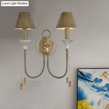 Vintage Iron Swooping Arm Sconce Light - Gold Wall Mount Lamp With Tapered Shade And Carved Spike