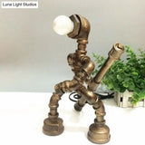 Vintage Metallic Brass Robot Design Table Lamp - Unique Coffee Shop Light With Plumbing Pipe Accent