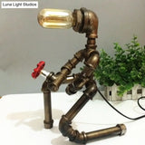 Vintage Metallic Brass Robot Design Table Lamp - Unique Coffee Shop Light With Plumbing Pipe Accent