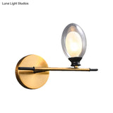 Vintage Oval Wall Sconce With 1 Clear Glass Light - Bedroom Mounted Lamp Featuring Brass Bar