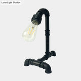 Vintage Rust/Black Metal Arm Night Table Plug-In Lamp With Exposed Bulb