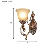 Vintage Sconce Light Fixture: 1-Light Frosted Glass Wall Mount With Carved Metal Arm In Rust