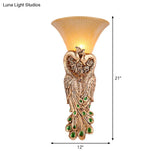 Wall Sconce With Countryside Design And Fluted Amber Glass - Peacock Decor In Gold