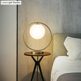 White Glass Ball Bedside Lamp With Gold Ring Decor - Single Minimalistic Table Light