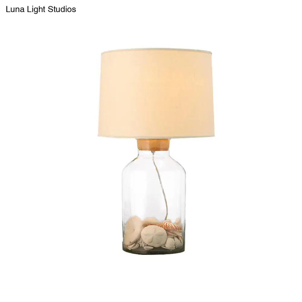 White Traditional Night Table Lamp With Clear Glass Base And Fabric Barrel Shade